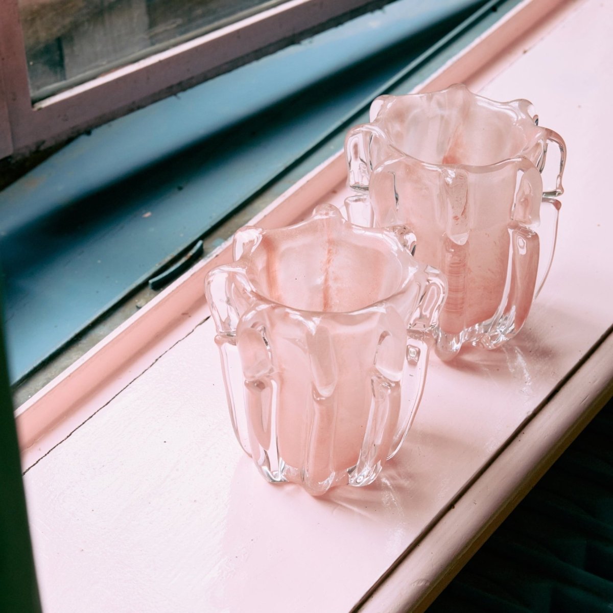 HKliving Corella candle holder with a modern design, featuring a sleek glass container for holding candles.