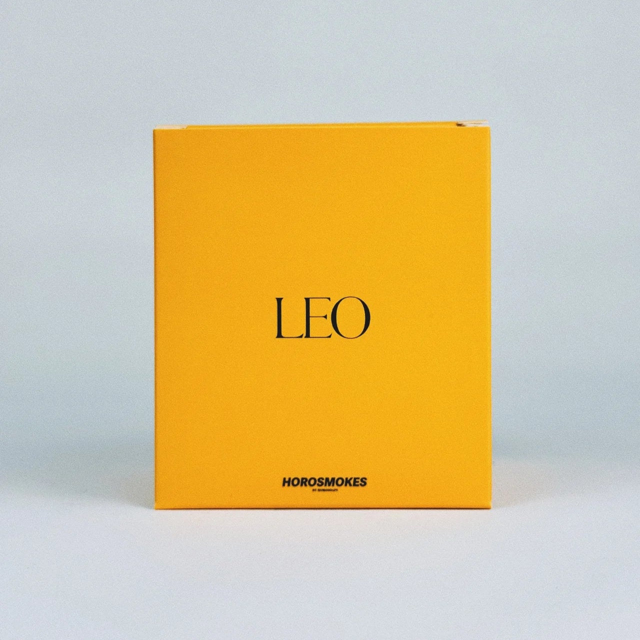 Horosoaps Leo Horosmokes candle with zodiac-themed design, featuring a decorative candle in a sleek container.