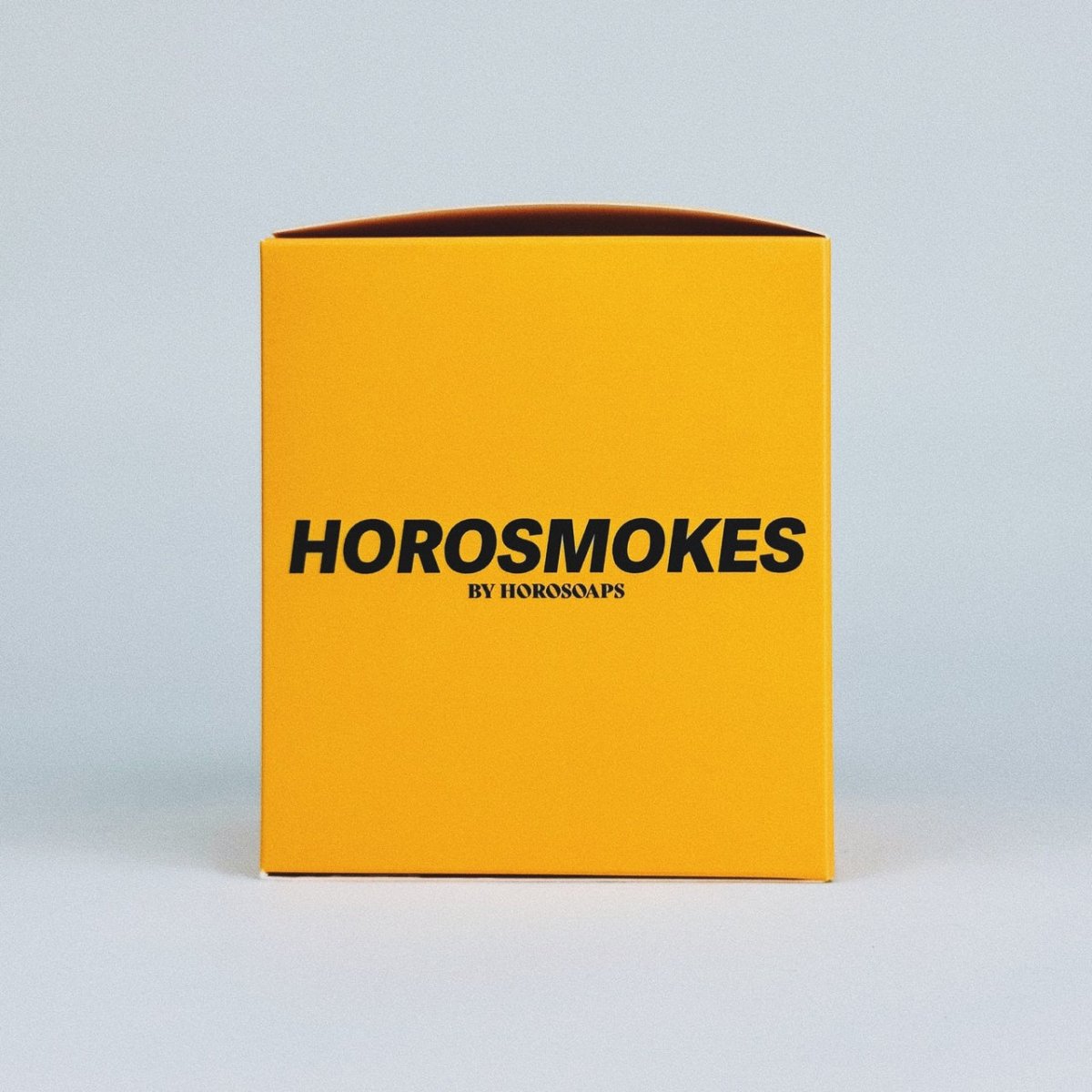 Horosmokes Leo candle by Horosoaps featuring a sleek design with zodiac-inspired details and warm candlelight.