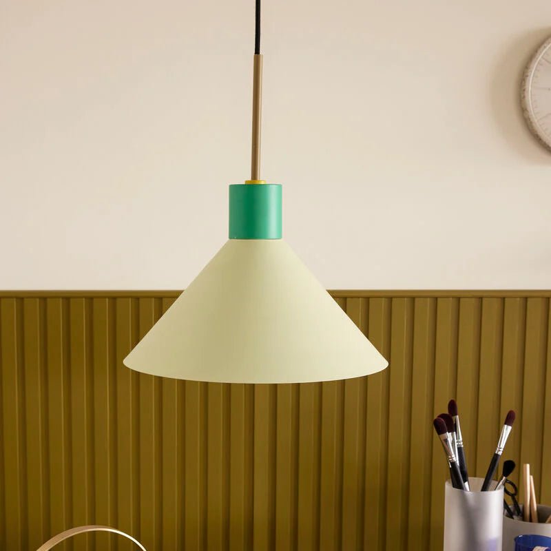 Green Hübsch Crayon Pendant Lighting fixture hanging from the ceiling with a modern, sculptural design.