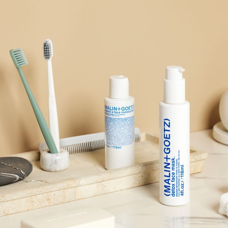 Malin+Goetz Detox Face Mask applied on clean skin, showcasing its skincare benefits and smooth, refreshed appearance.
