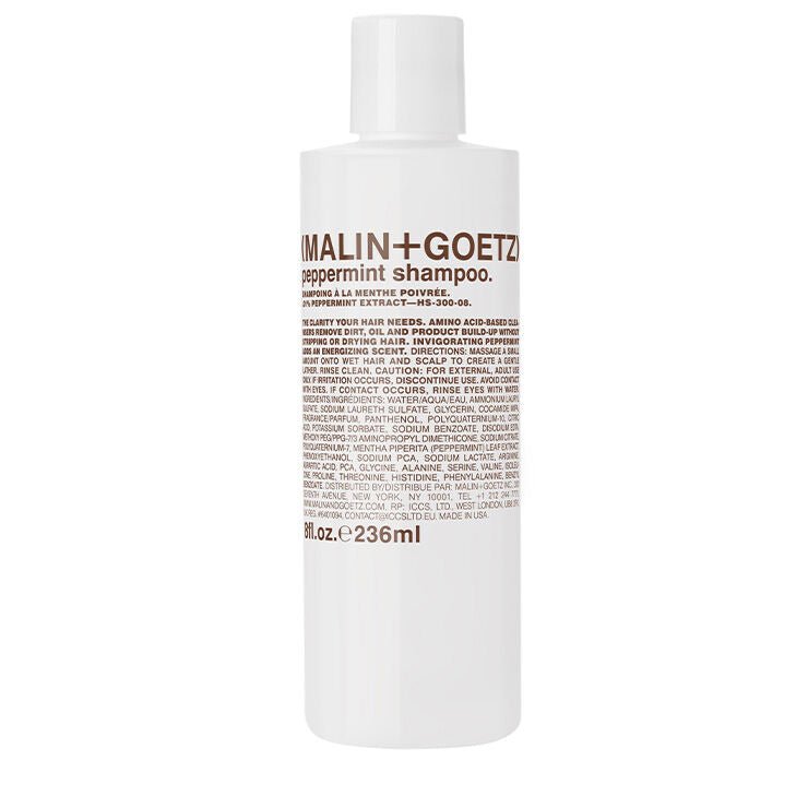 Malin+Goetz Peppermint Shampoo 236ml in clear bottle with peppermint leaves, suitable for refreshing scalp and hair care.