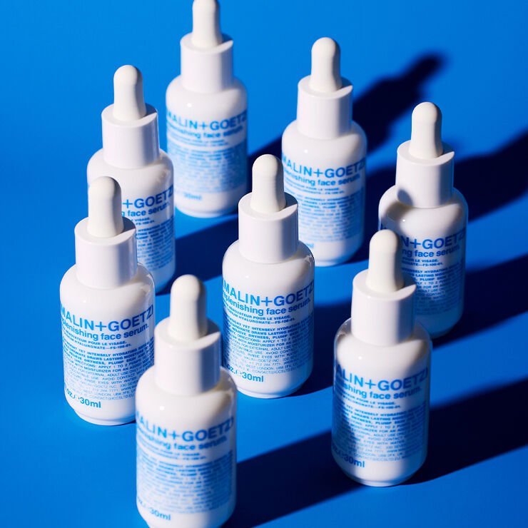 MALIN+GOETZ Replenishing Face Serum in a clear glass bottle with dropper, skincare product for hydration and renewal