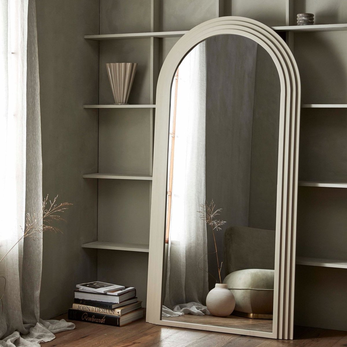 Nordal A/S FALCO Sand mirror with a sleek, modern frame, reflecting a stylish interior setting.