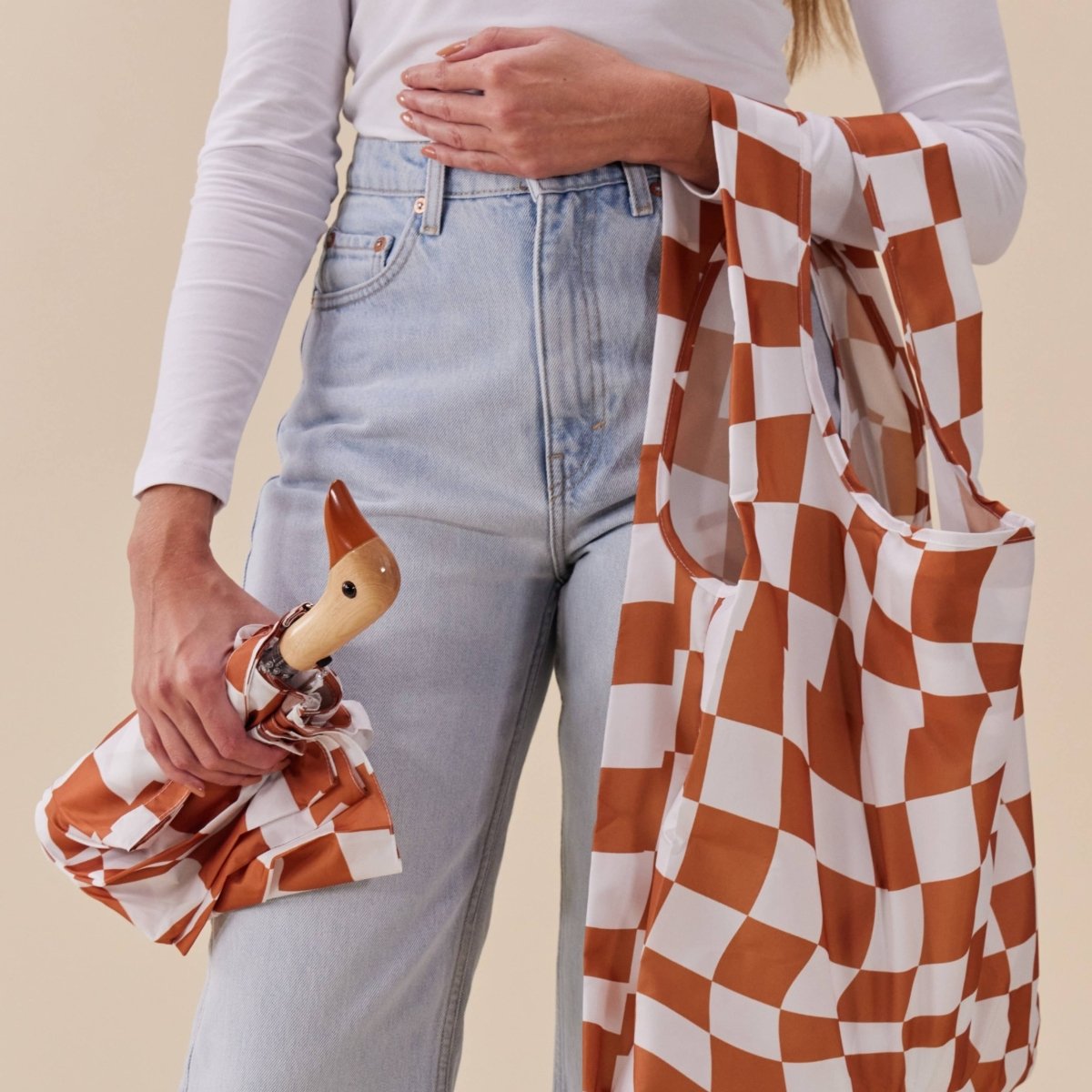 Peanut butter checkers eco-friendly Duckhead umbrella from Original Duckhead EU, open to show colorful patterned canopy.