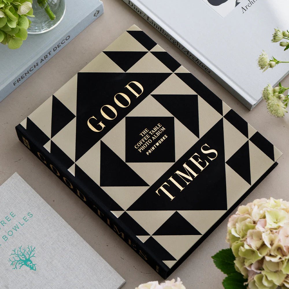 Printworks Good Times photo album with black cover and spiral binding, featuring blank pages for personal photos.