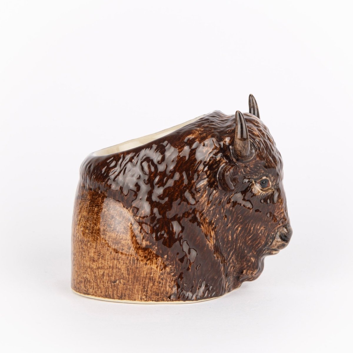 Ceramic buffalo head egg cup on a white background