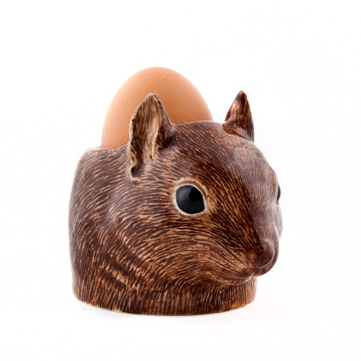 Egg holder shaped like a squirrel's head with an egg inside on a white background
