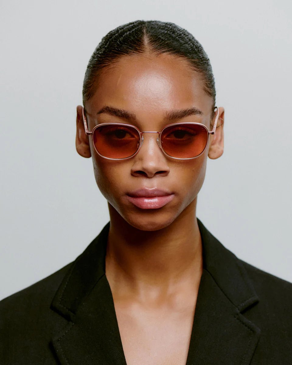Rose gold Hello sunglasses by A. Kjaerbede with stylish frame and tinted lenses, perfect for a chic, fashionable look.