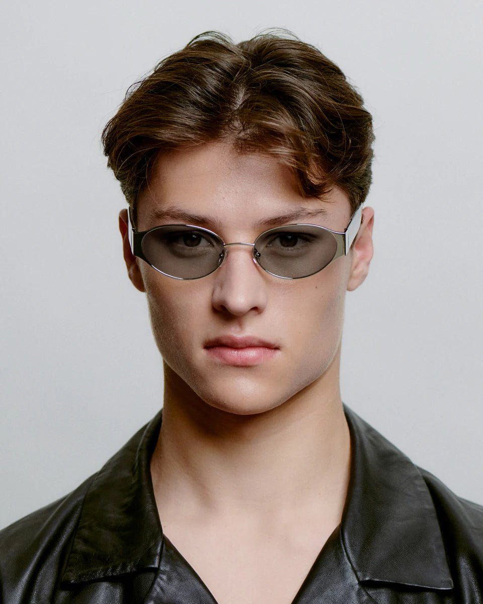 Silver crystal Bella sunglasses by A. Kjaerbede featuring sleek frames and reflective lenses in a close-up shot.