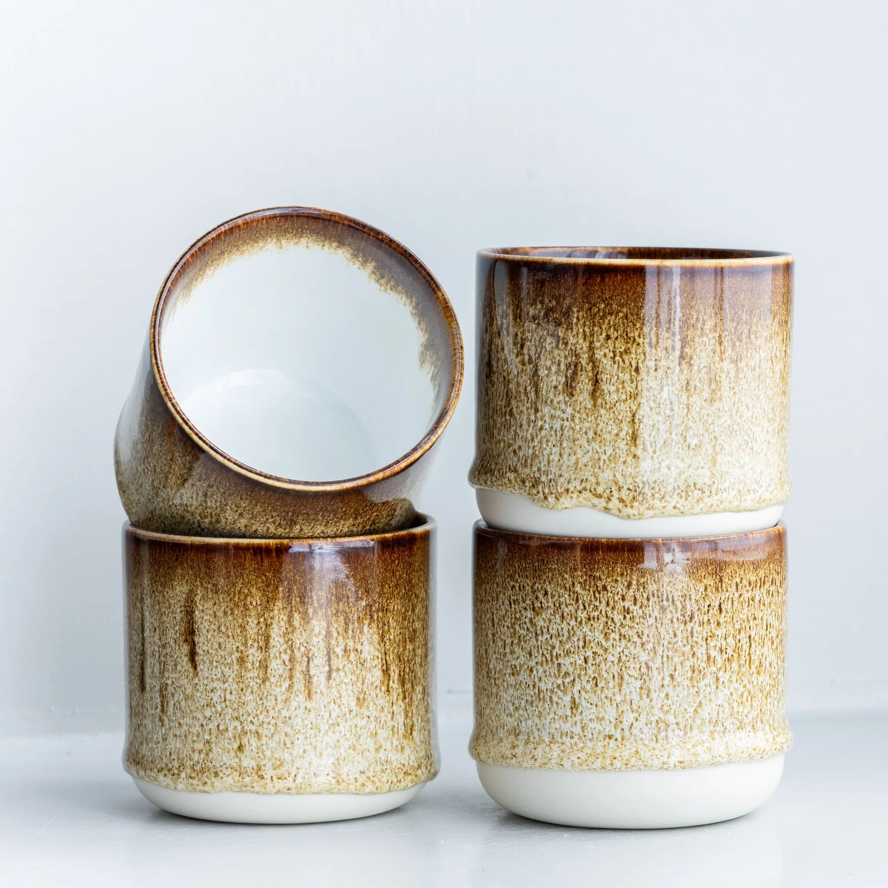 Ceramic Chocolate Fizz Quench Cup by Studio Arhoj featuring a glossy, colorful glaze and unique artistic design.
