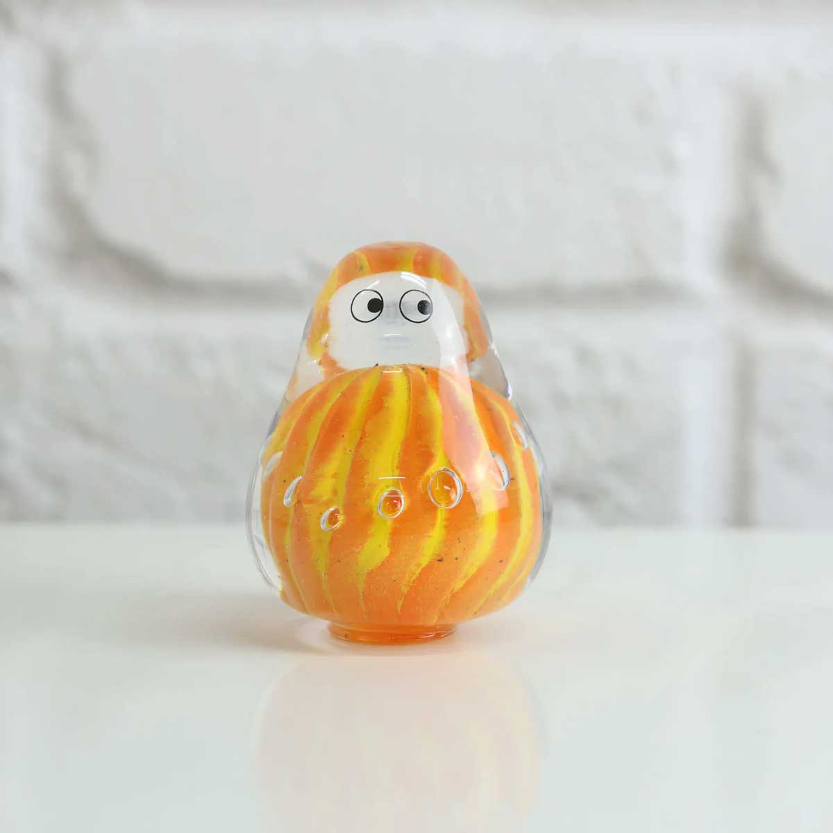 Studio Arhoj decorative crystal blob sculpture with vibrant, translucent colors and organic, abstract shape.
