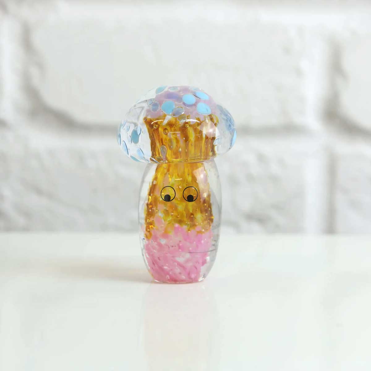 Decorative crystal blob sculpture by Studio Arhoj, featuring a translucent, colorful glass art piece with swirling patterns.