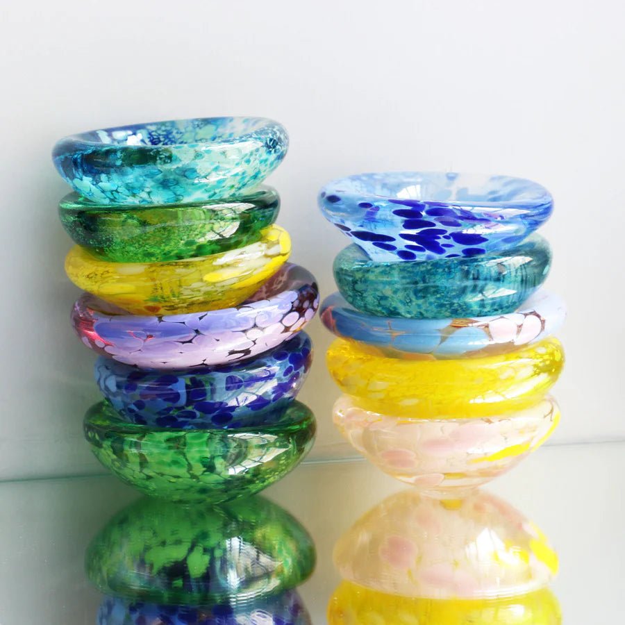 Studio Arhoj Puddle glass object featuring a colorful, handmade design with vibrant patterns and a smooth, rounded shape.