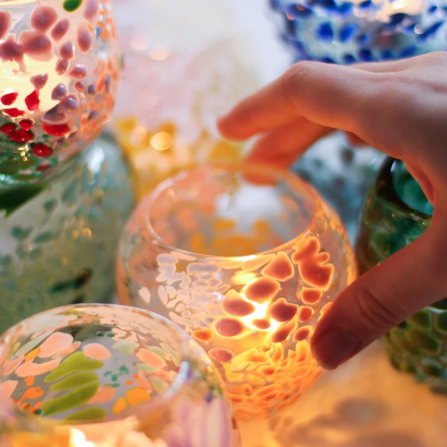 Colorful glass urchin sculpture by Studio Arhoj, featuring vibrant patterns and unique glass craftsmanship.
