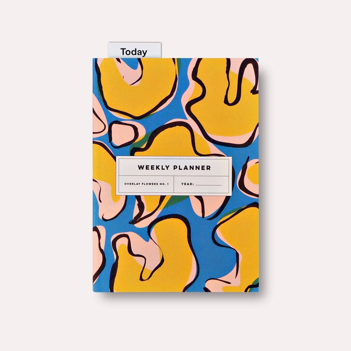 Lay flat weekly planner book with floral overlay design by The Completist, undated and ideal for organizing weekly schedules.