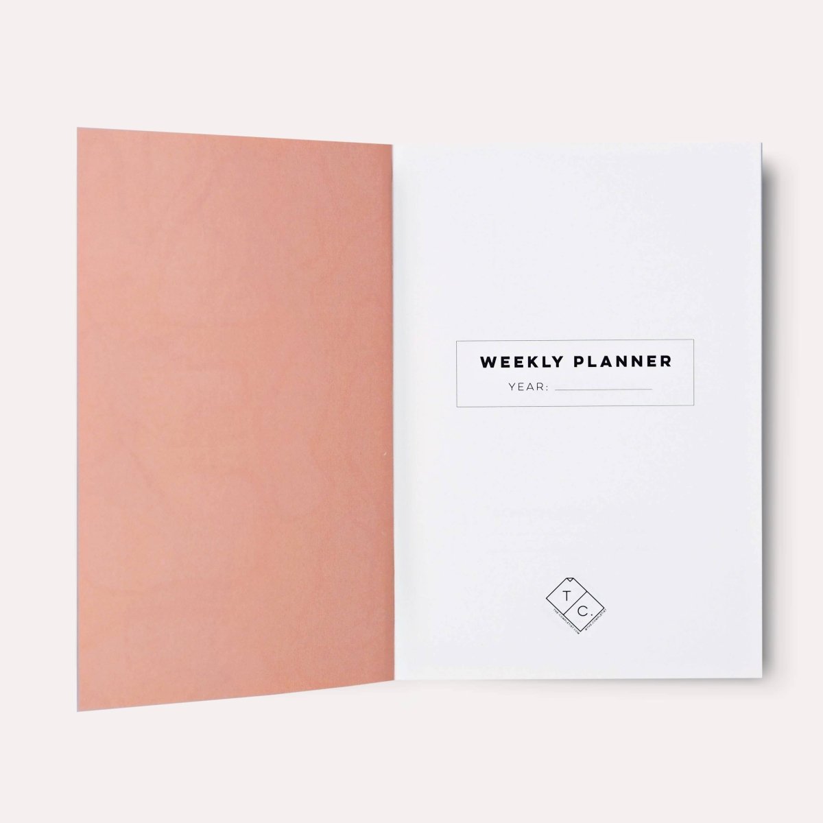 Overlay Flowers No. 1 weekly planner book by The Completist, featuring a lay-flat design with floral cover artwork.