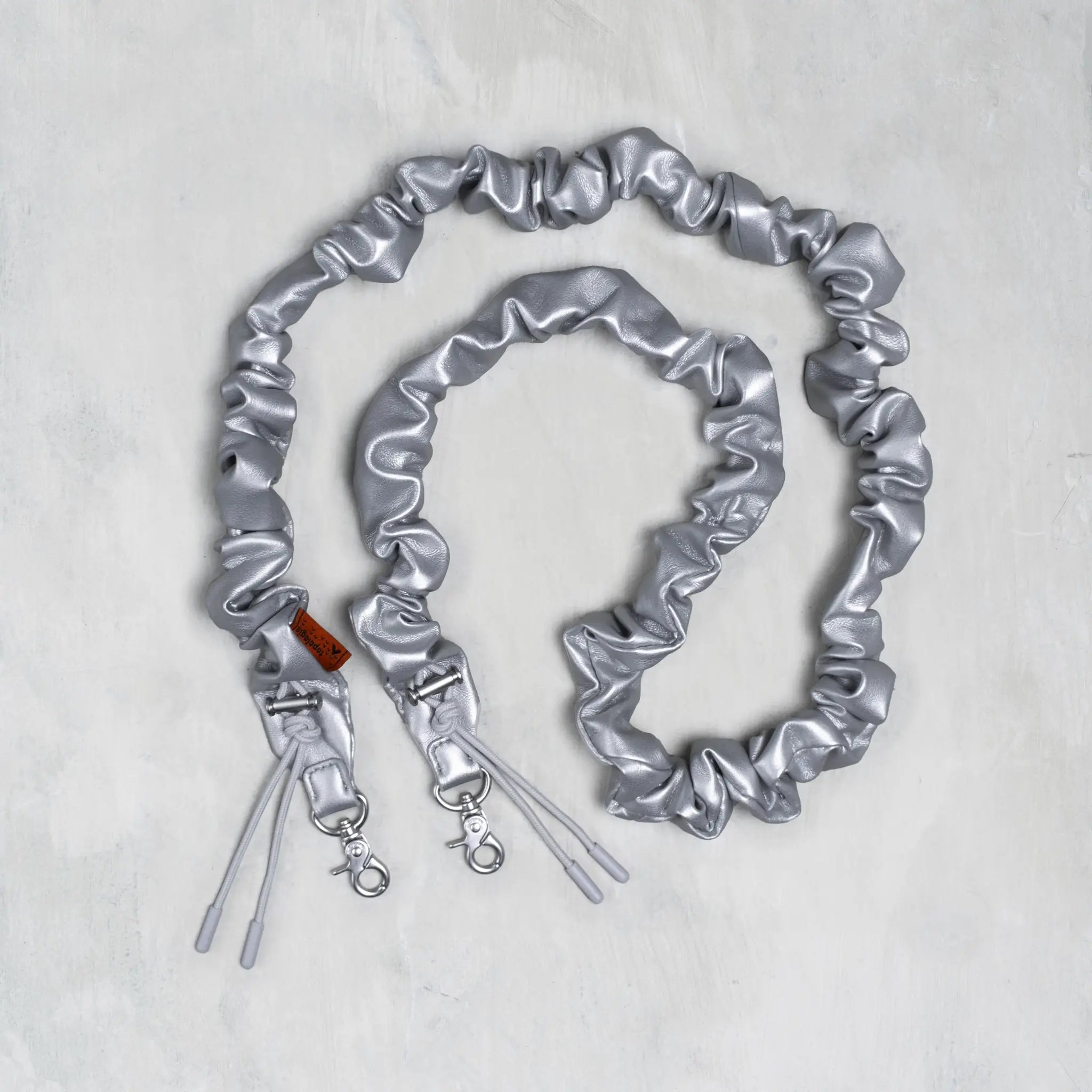 Topologie Bungee Strap for Bags, featuring durable elastic cords and adjustable hooks for secure attachment and versatile use.