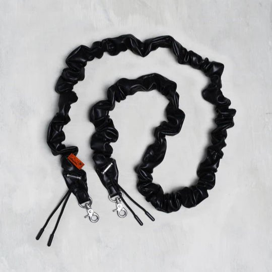 Topologie Bungee Strap for bags, featuring adjustable elastic cord with metal hooks for secure attachment and versatile use.