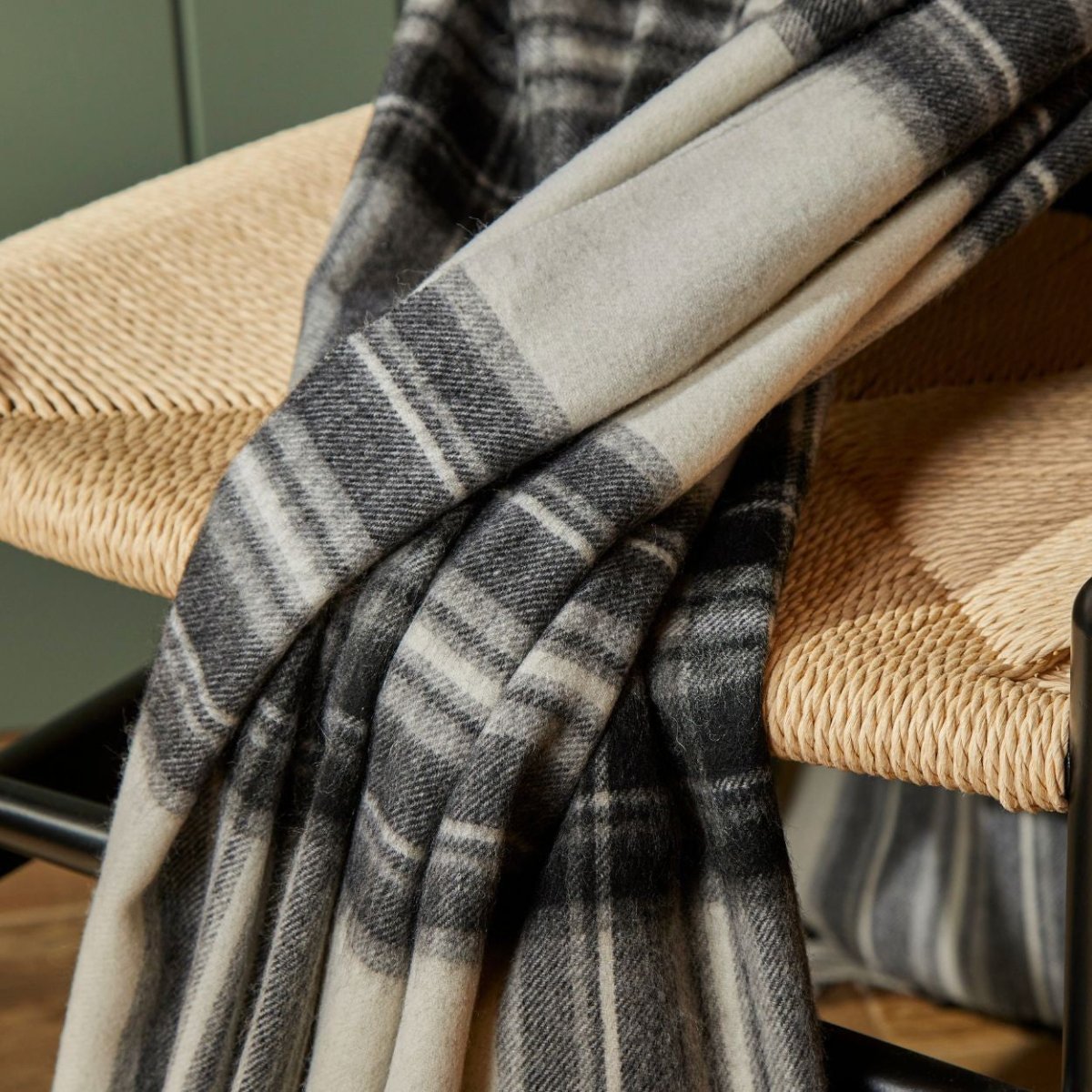 Tweedmill wool blanket made from soft lambswool, showcasing a cozy, textured fabric in neutral tones.