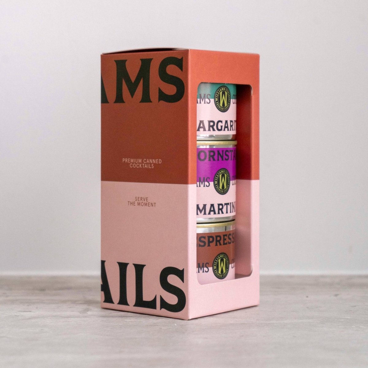 Set of 3 Williams Premium Canned Cocktails featuring colorful cans with fruit illustrations and modern branding.