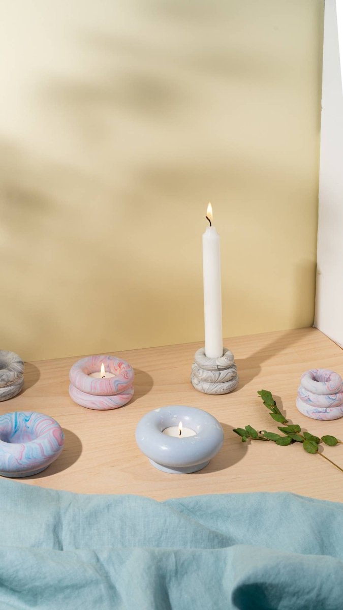 Grey marble Triple O candleholder by YOD&CO with three open circular holders on a sleek base.