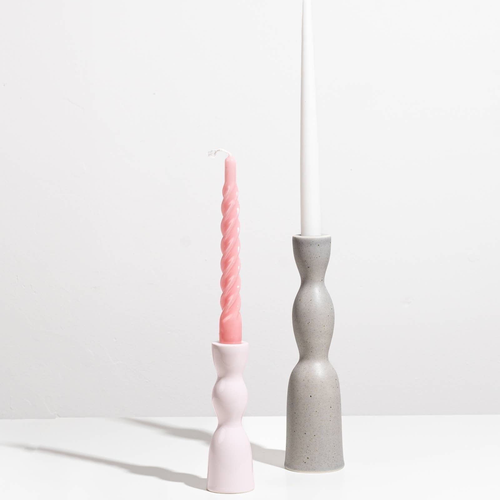 Tall grey speckle Wave Candleholder by YOD&CO featuring a sleek, modern design with a curved shape and smooth finish.