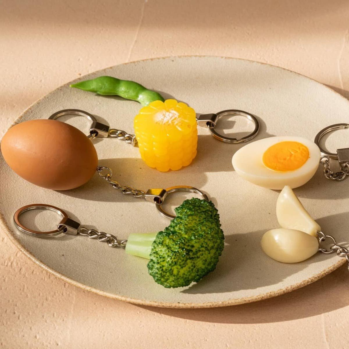 Yumazing Connectrade AG keychain featuring a colorful egg-shaped accessory with vibrant design details.