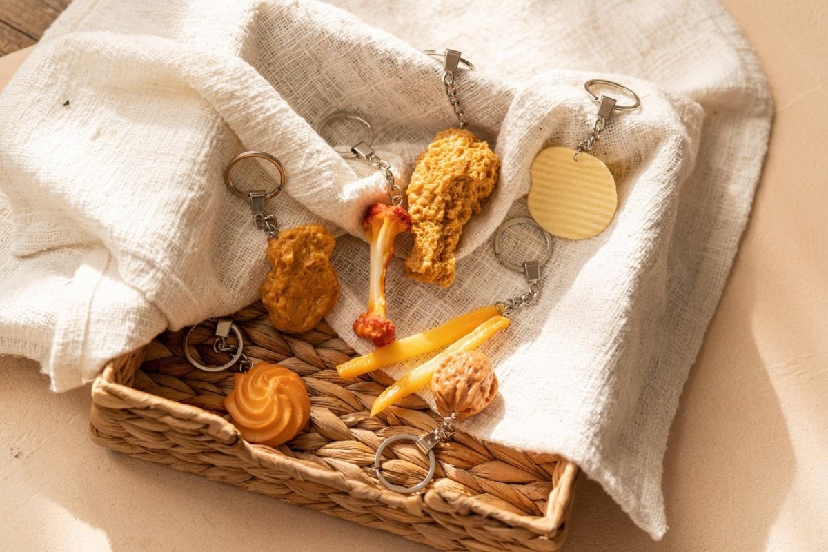 Yumazing Keychain featuring a Spritzgebäck cookie design, connected to a metal keyring, with detailed cookie and brand branding visible.