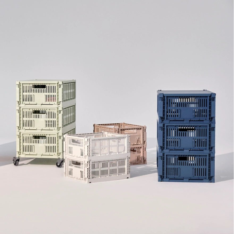 Set of four grey crate wheels by HAY, showing sturdy plastic casters suitable for furniture or storage crates.