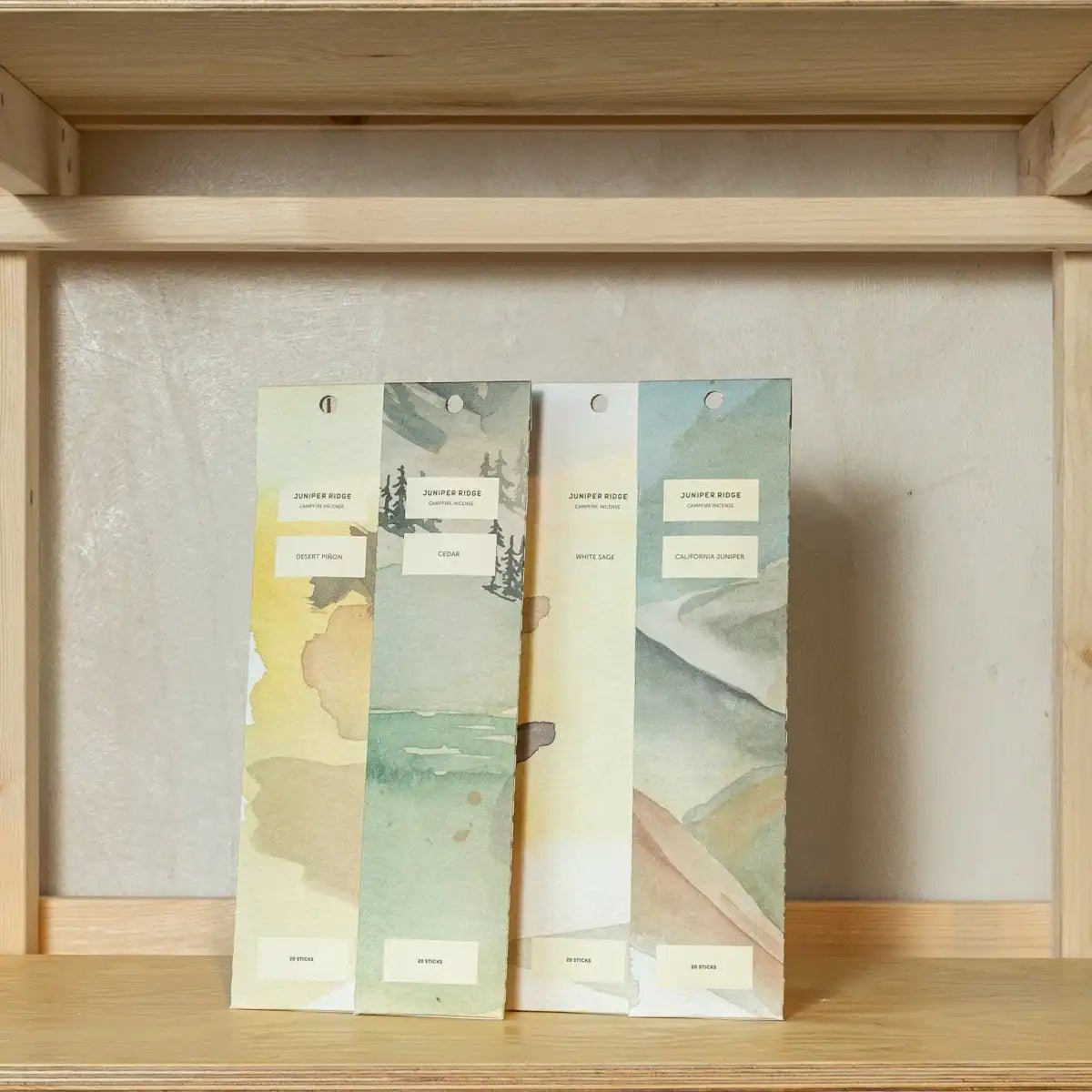 Juniper Ridge Campfire Incense Cedar scent sticks in a natural setting with cedar wood and smoke aroma, ideal for creating a cozy atmosphere.