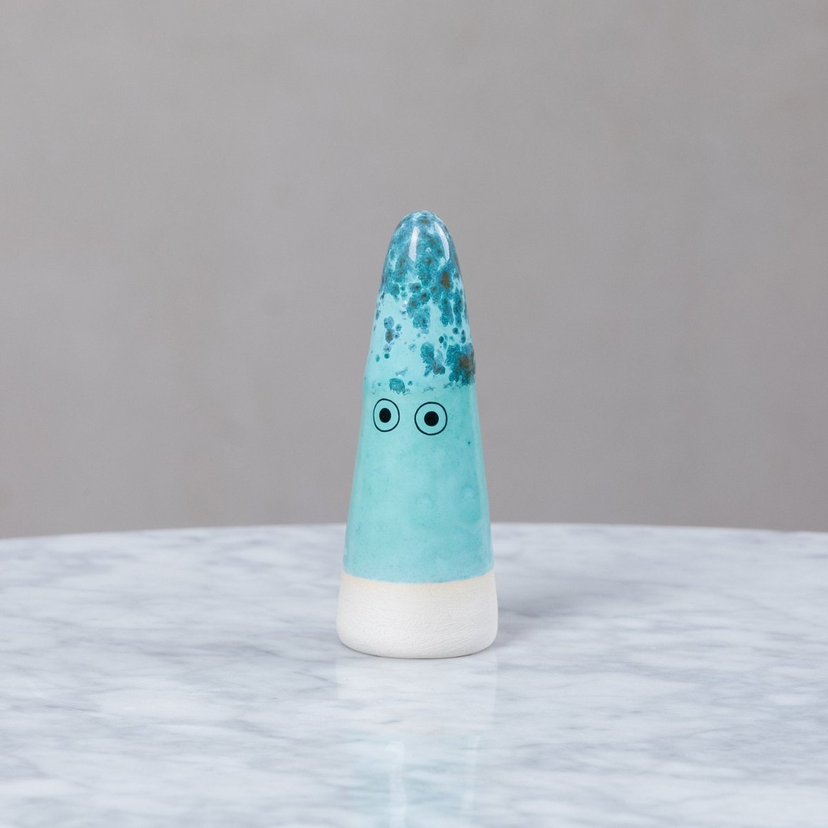 Studio Arhoj ceramic Ghost figurine with a smooth, glossy finish and whimsical design, showcasing its playful, artistic style.