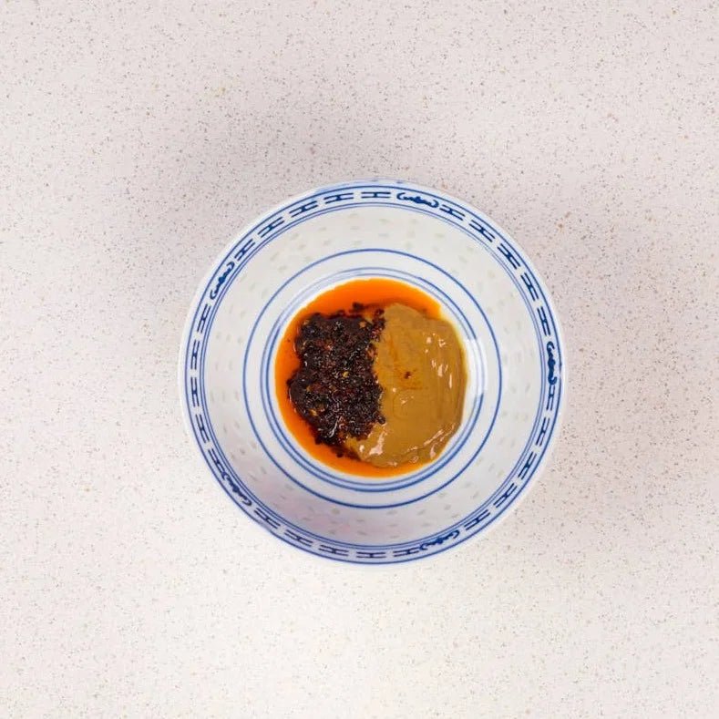 White Mausu Ltd Black Bean Rayu Sauce in a jar, showcasing the dark, savory sauce with black bean and chili ingredients visible.